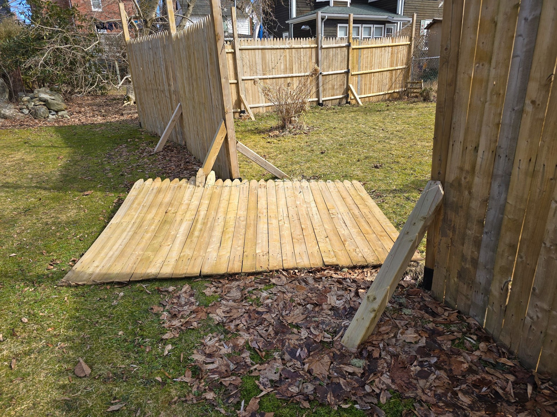 Section of fence blown over